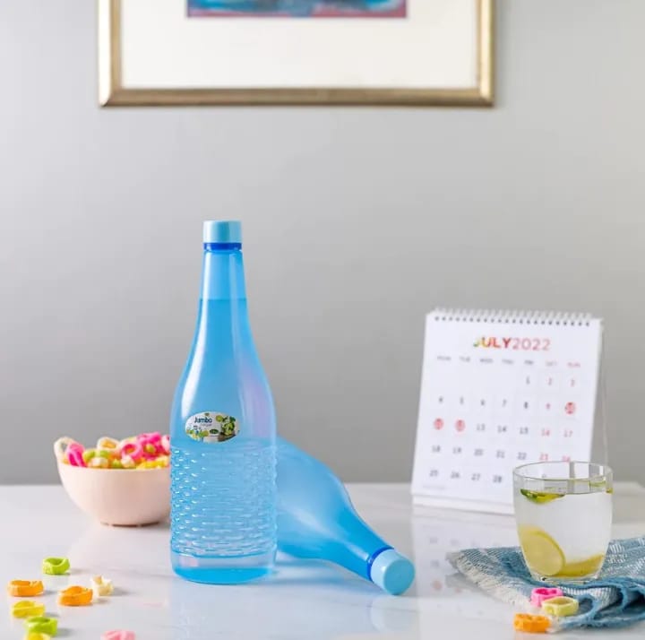 Blue bottle shown with pink, orange and green bottles